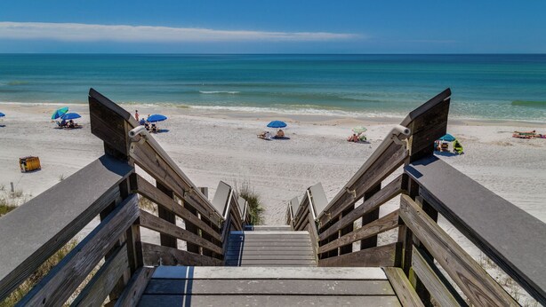 A wooden staircase leading to a beach with umbrellas and beach chairs. - Seagrove Charm + Free Activity Tickets: Bikes, Dolphin Cruise & More! (Santa Rosa Beach)