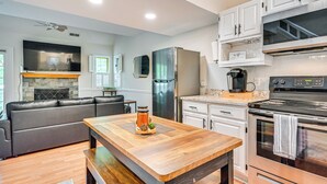 A modern kitchen with a built-in oven, a refrigerator, and a coffee maker. - 1 Mi to Mohegan Sun: Studio w/ Pool Access (Norwich)