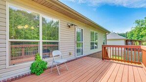 A wooden deck with a railing, a folding chair, and a potted plant. - 11 Mi to Dtwn Little Rock: Home w/ Large Deck! (Mabelvale)
