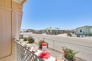 Stroll through a charming neighborhood lined with unique homes and a welcoming birdbath.