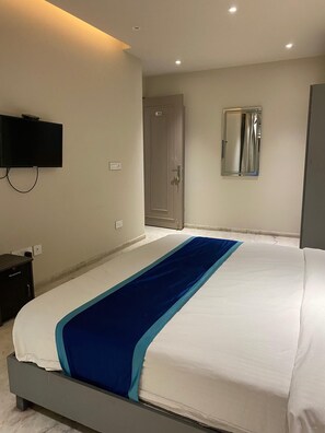 Deluxe Double Room | Desk, laptop workspace, blackout drapes, iron/ironing board - Raahgir Suites (Noida)