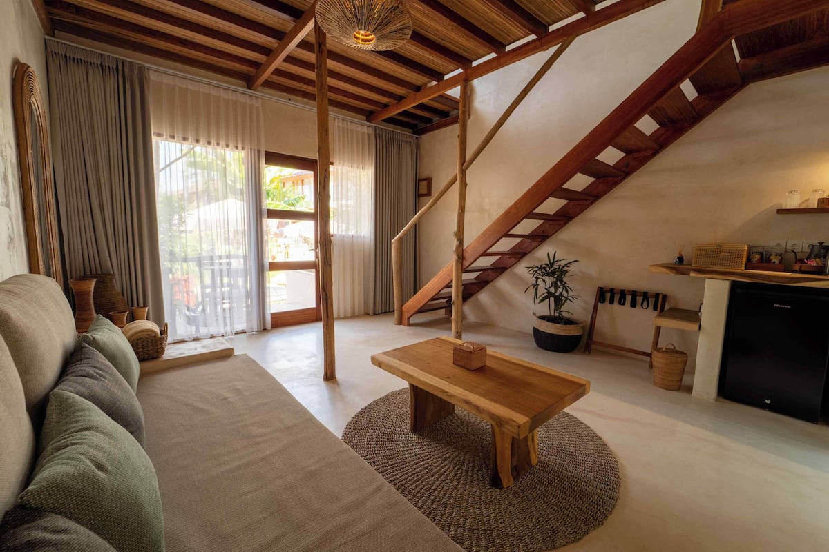 King Suite with Hot Tub + Unlimited Coffee | Living area | 50-inch LED TV with digital channels, Netflix, streaming services