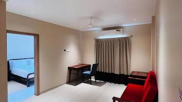 Family Room, 1 Bedroom, City View | In-room safe, desk, laptop workspace, iron/ironing board