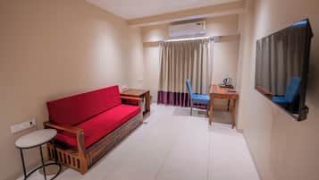 Family Room, 1 Bedroom, City View | In-room safe, desk, laptop workspace, iron/ironing board