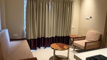 Family Room, 1 Bedroom, City View | In-room safe, desk, laptop workspace, iron/ironing board