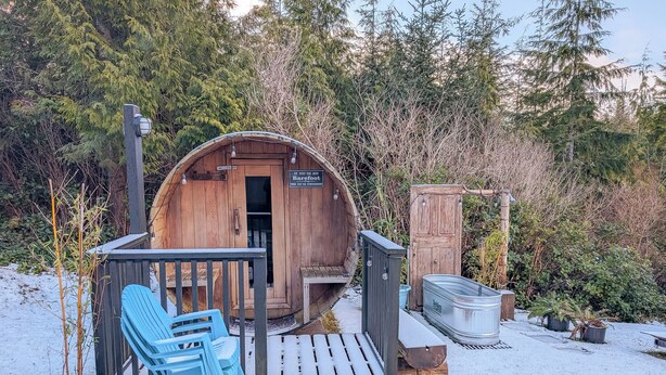 A rustic wooden structure with a door labeled "Barefoot." - Little Beach Resort (Ucluelet)