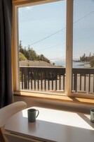 Oceanview Jacuzzi Suite | Living area | 32-inch LED TV with digital channels, streaming services, printers