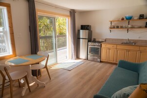 One Bedroom Suite with Kitchen | Private kitchen | Full-size fridge, microwave, coffee/tea maker, electric kettle