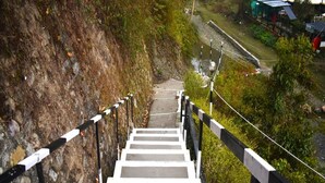 A staircase leading down a hillside with railings on both sides. - Eden RiverSide Camp (Lansdowne)