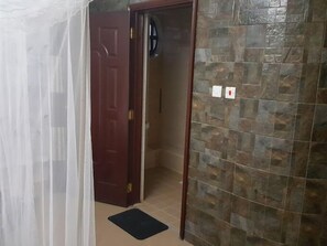 Shower, free toiletries, slippers, towels