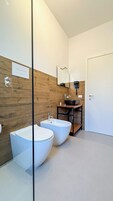Deluxe Room, Balcony, City View | Bathroom | Shower, hair dryer, bathrobes, bidet