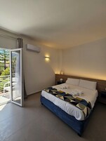 Deluxe Studio Suite, Balcony, City View | Desk, laptop workspace, blackout drapes, soundproofing