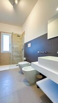 Superior Studio Suite, Balcony | Bathroom | Shower, hair dryer, bathrobes, towels