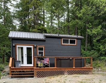 Tranquil Tiny Home deck with seating, hot-tub and BBQ