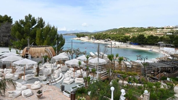 A resort with outdoor seating areas, a pool, and a beach view. - EMAR Beachfront Hotel Ksamil (Ksamil)