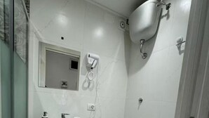 A compact bathroom with a pedestal sink, a toilet, and a bidet. - Apartment in the heart of Naples Corso Umberto I Kitchen Wi-Fi climate center port (Napoli)