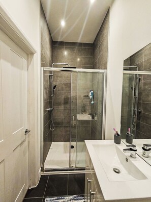 Shower, hair dryer, towels, soap