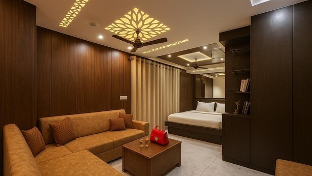 Ein modernes Hotelzimmer mit einer Couch, einem Bett, einem kleinen Tisch und einem Kleiderschrank.