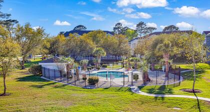 Golf course view condo with patio, W/D, pool & close to beach