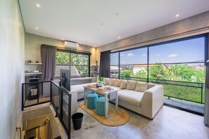 Comfort Studio, Balcony, Garden View | Living area | 42-inch Smart TV with digital channels - Blanca-21 - Duplex Apartment (Canggu)