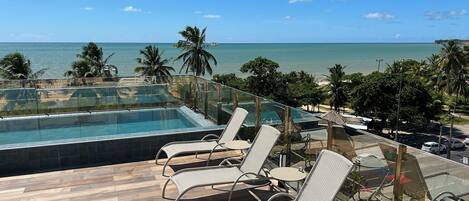 Outdoor pool, open 8:00 AM to 10:00 PM, pool umbrellas, pool loungers