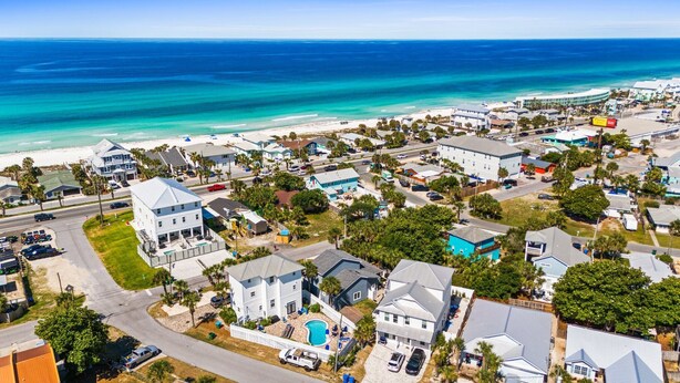 A coastal residential area with houses, a beach, and a clear view of the ocean. - Hot Tub, Sleeps 10, 1 block to beach access, Pets (Panama City Beach)
