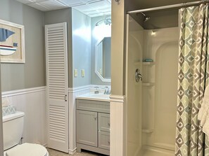 Shower, hair dryer, towels, toilet paper