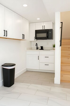 Mini-fridge, microwave, stovetop, coffee/tea maker