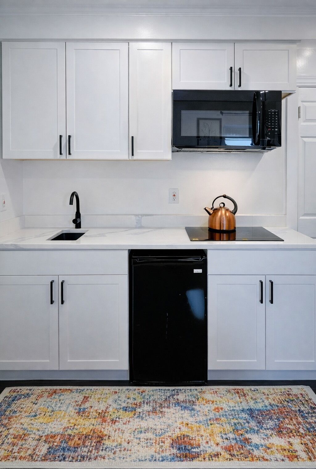 Mini-fridge, microwave, stovetop, coffee/tea maker