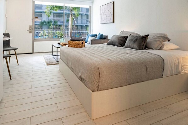 1 bedroom, desk, iron/ironing board, travel crib