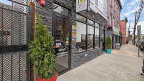 A restaurant named 'La Milpa Taqueria' with a sign indicating it is open every day from 11:00 AM to 11:00 PM.