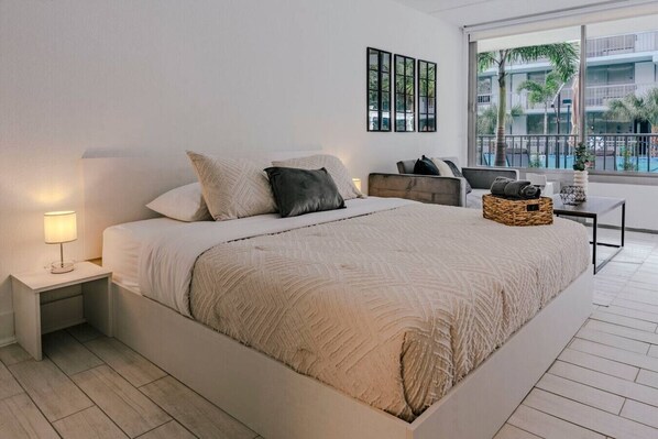 1 bedroom, desk, iron/ironing board, travel crib