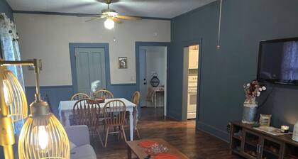 Enchanted Cottage, located in Herington, KS with 1.5 bedrooms and a shaded yard