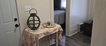 Enchanted Cottage, located in Herington, KS with 1.5 bedrooms and a shaded yard