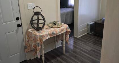 Enchanted Cottage, located in Herington, KS with 1.5 bedrooms and a shaded yard