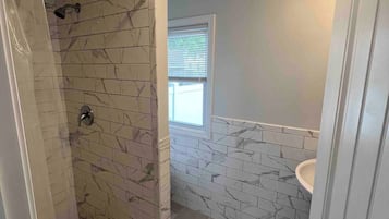 Shower, towels, soap, toilet paper