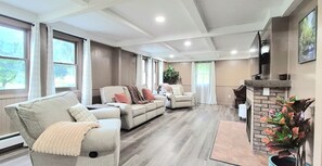 Smart TV, fireplace, table football, books