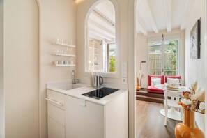 Deluxe Studio, Courtyard View | Private kitchen | Espresso maker, electric kettle, toaster, freezer