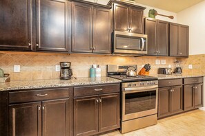 Coffee/tea maker, fridge, microwave, oven