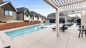 A pool area with lounge chairs and a pergola. - New- Pool, Hot Tub, Nintendo Switch, Pool, Pickleball and Ping Pong Fun (Santa Clara)