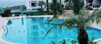 Apprt une Chambre salon vue sur piscines