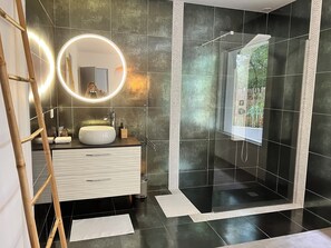 Shower, towels, soap, toilet paper