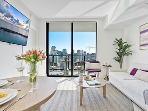 Premium Apartment, Balcony, Partial Ocean View | Living area | 42-inch Smart TV with cable channels