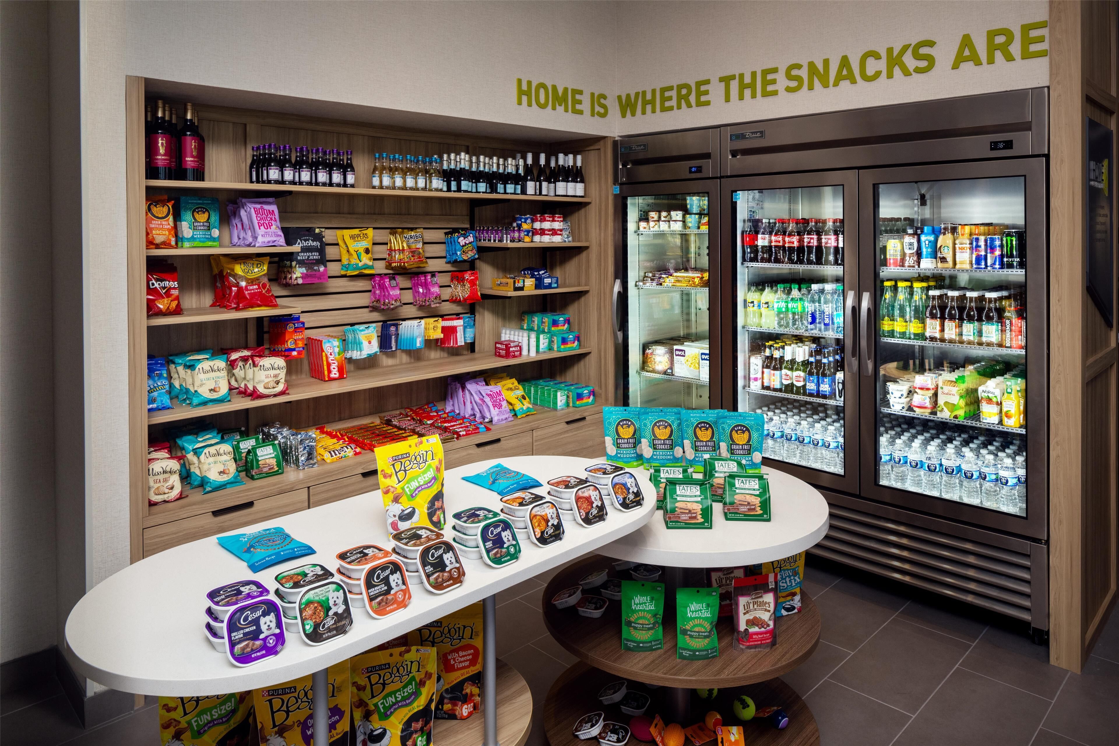 A snack display with various packaged snacks and beverages.