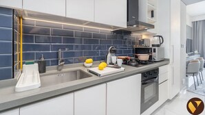 Coffee/tea maker, fridge, microwave, oven