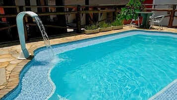 Outdoor pool, open 10:00 AM to 8:00 PM, pool umbrellas