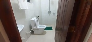 Shower, free toiletries, slippers, towels