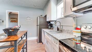 Fridge, microwave, stovetop, coffee/tea maker