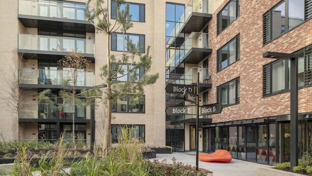 A modern multi-story building with glass balconies and brick facades. - Arran Quay - Ardcairn House - Campus Accommodation (Dublin)