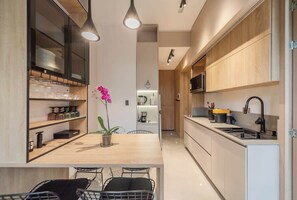 Apartment, 2 Queen Beds, Balcony, City View (Oruga 403) | Private kitchen | Coffee/tea maker